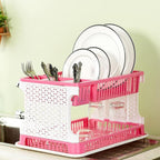 Pink kitchen organizer rack with a water storing tray arranged neatly on countertop