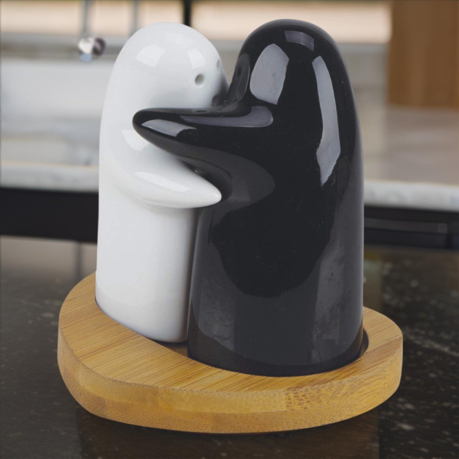 White ceramic salt shaker with clean modern hugging couple design