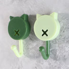 Close-up of beige round self adhesive stick-on wall hooks