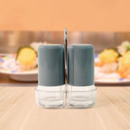 Salt shaker being refilled easily with wide opening for mess-free use