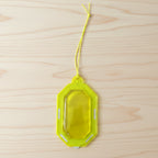 Hanging citrus gel air freshener on a towel rod