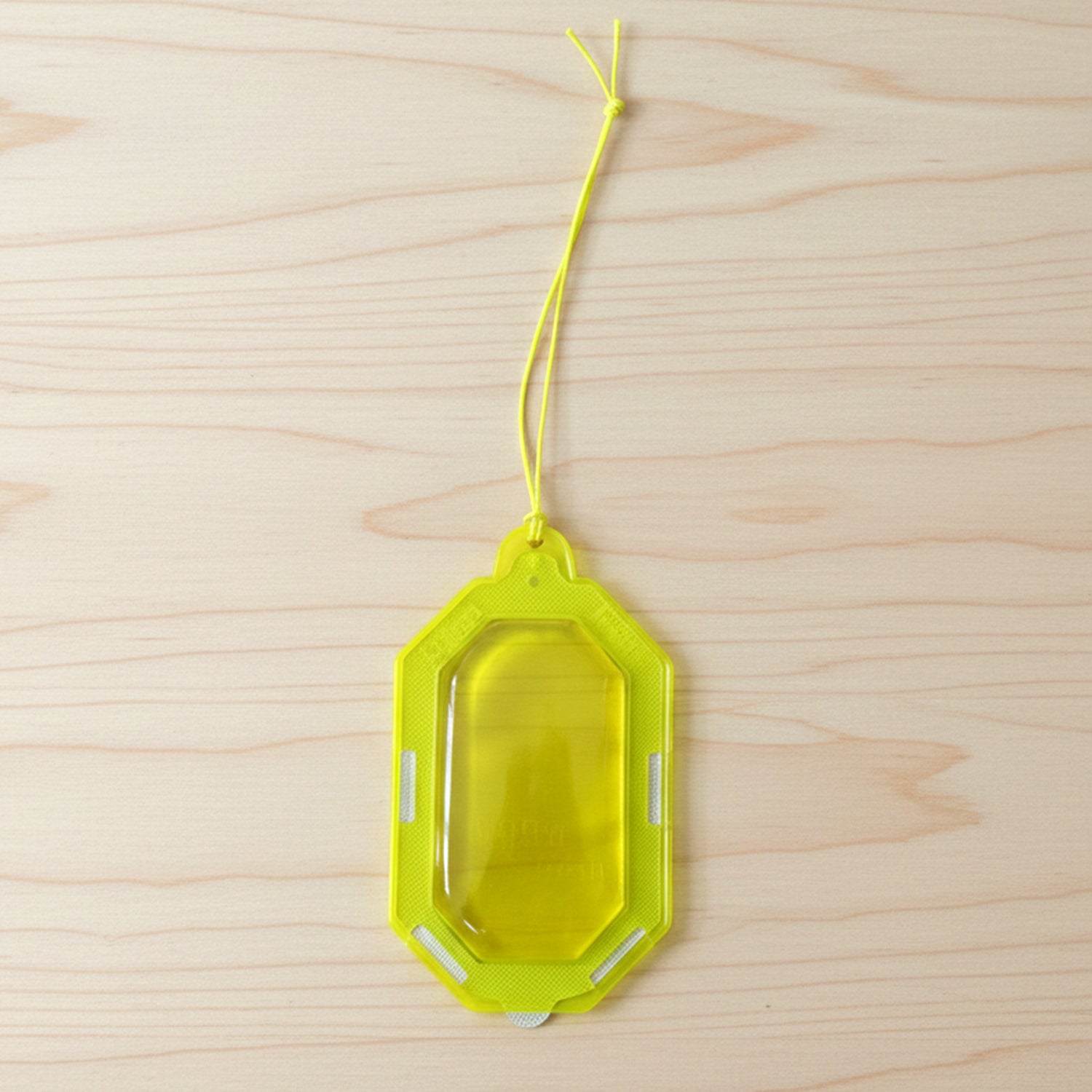 Hanging citrus gel air freshener on a towel rod