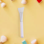 Side view of silicone mask applicator brush with flexible head