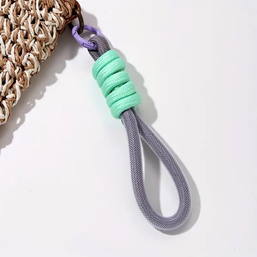 Hand holding a smartphone with the secure phone grip provided by the attached wrist strap.