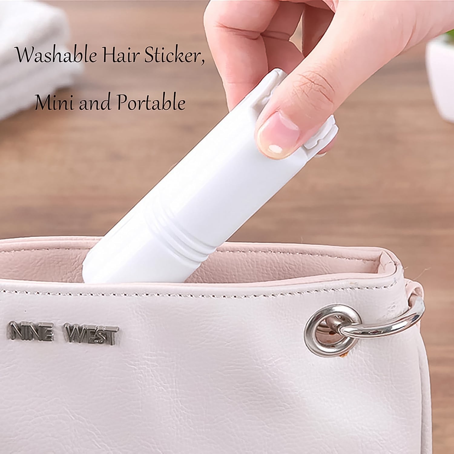 The washable lint roller being rinsed under tap water, showing its easy cleaning process.