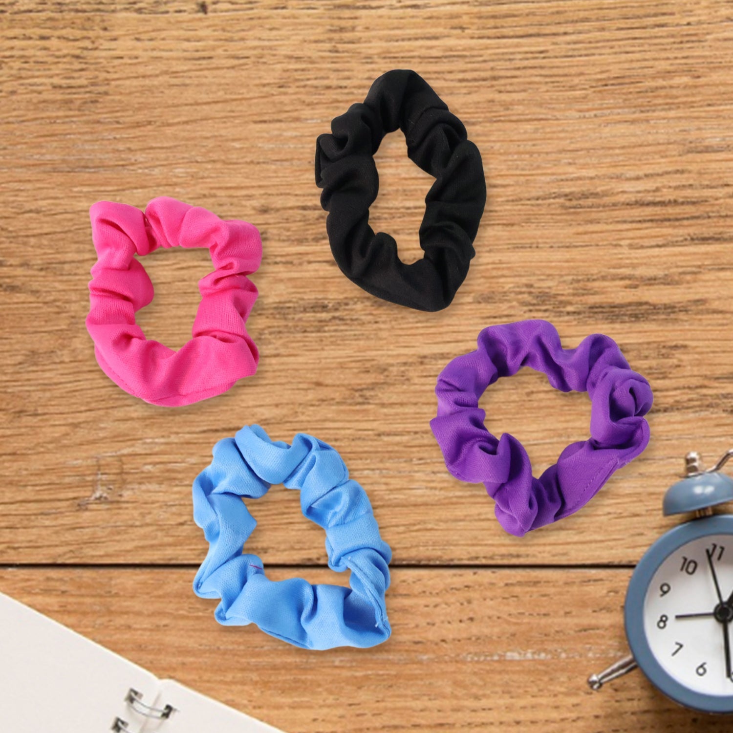A soft hair scrunchie tied neatly around a hair bun, demonstrating a secure and comfortable hold.