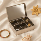 Stainless steel jewelry organizer box with 6 compartments, closed view, featuring traditional motifs.