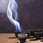 Detailed view of the divine design and texture on a Gugal Sambrani Havan cup.