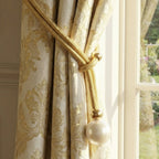Modern window curtain holder showcasing braided rope and pearl design