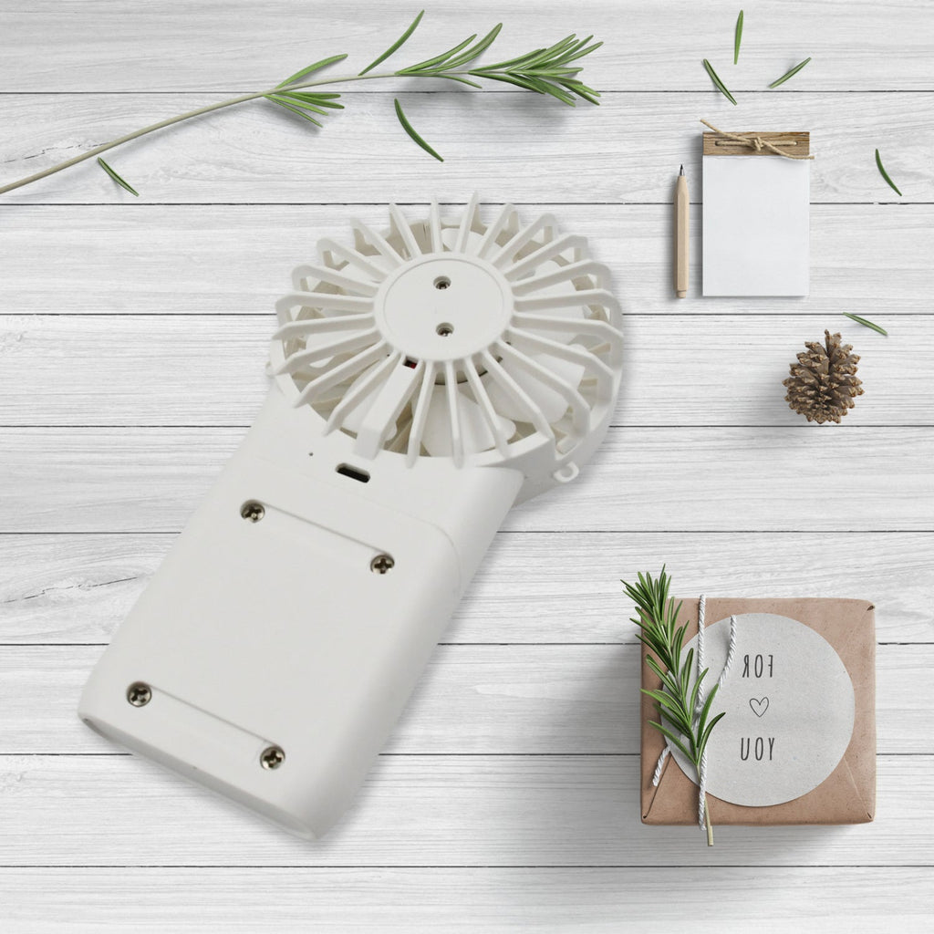 Close-up of the simple one-button control on the portable personal fan.