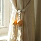 Magnetic curtain band wrapped around a curtain for easy installation.