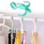 The GlimmerHome 360-degree rotatable purse hanger hook from another angle, showing its versatility.