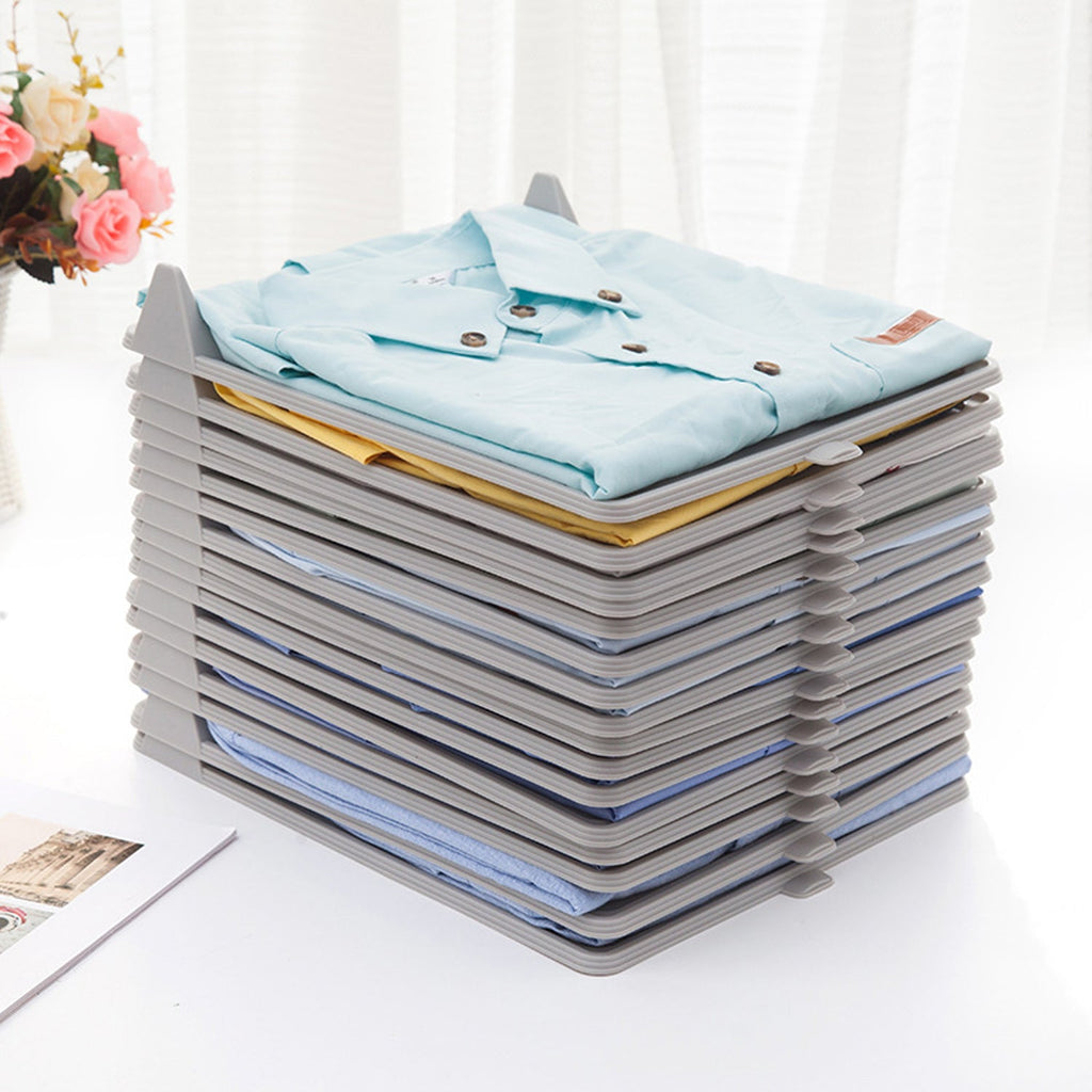 Compact plastic cloth organizer with folded garments, ideal for ironing shops.
