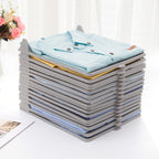 Compact plastic cloth organizer with folded garments, ideal for ironing shops.