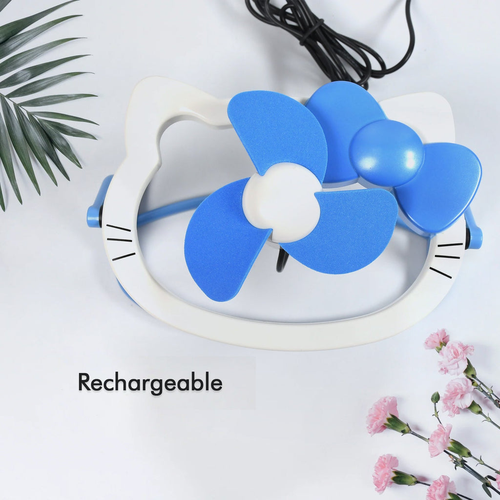 Small USB Mini Fan placed on a tabletop, demonstrating its compact size.