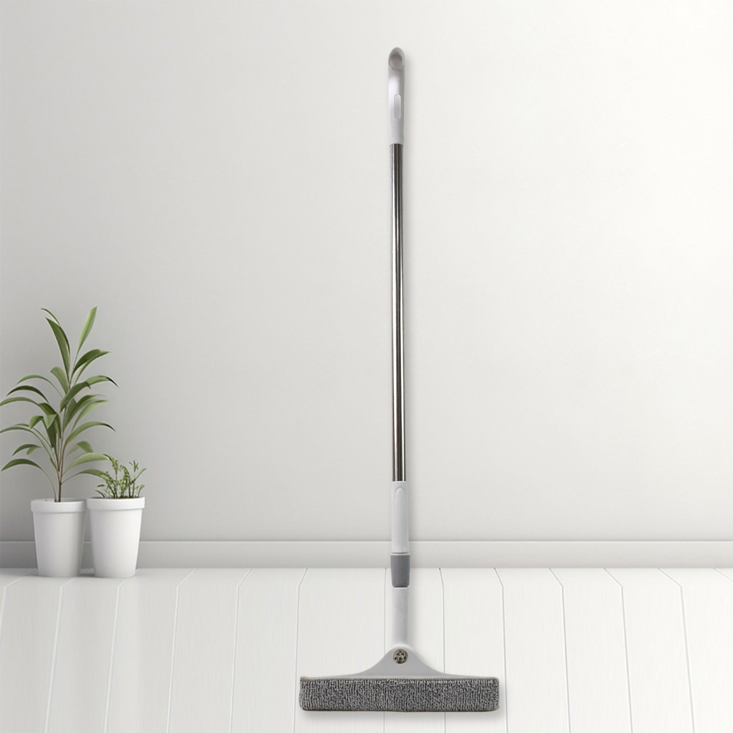 Close-up of the 2-in-1 window cleaning squeegee head with brush and rubber blade