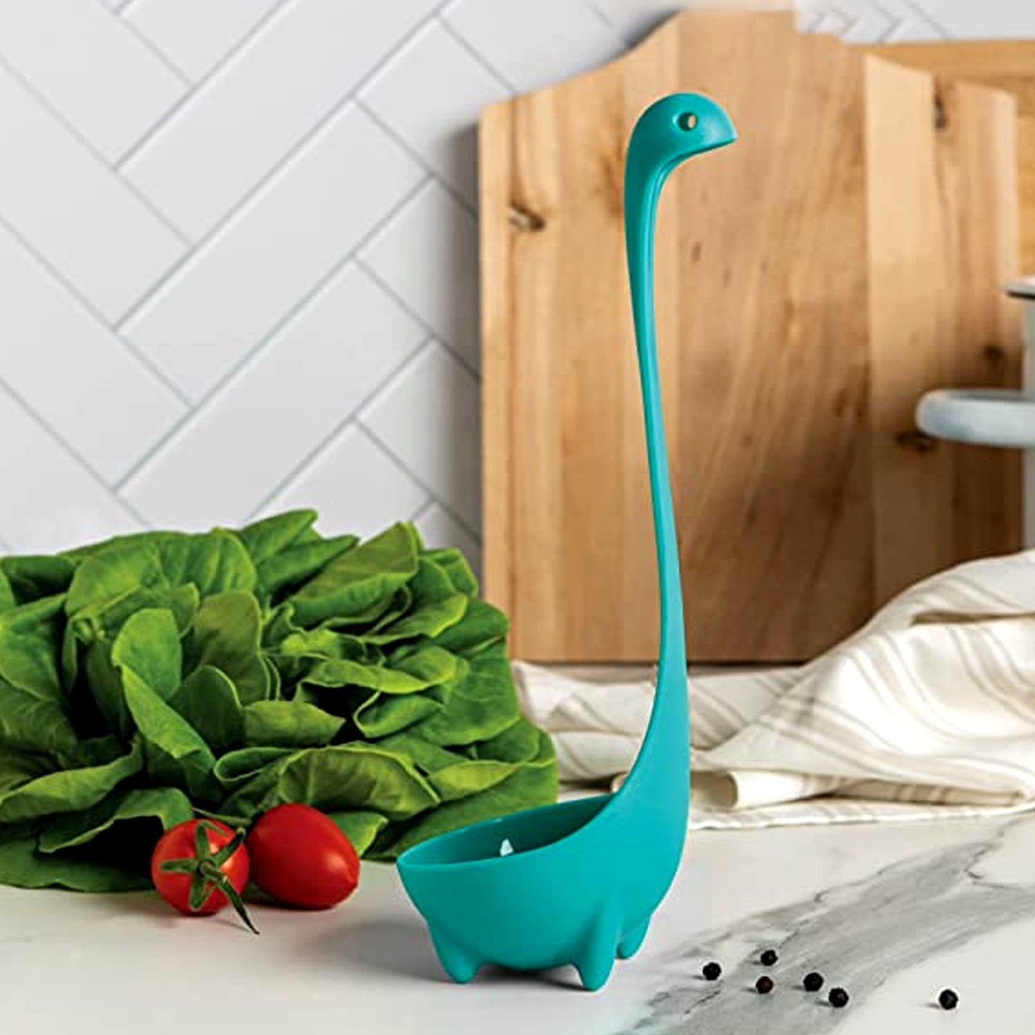 Cross-section view showing the robust stainless steel core of the silicone soup spoon.