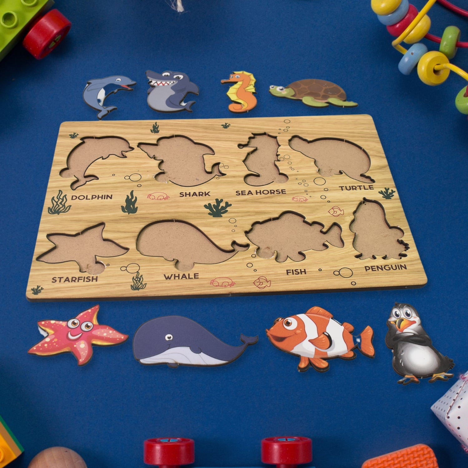 Detailed view of the smooth, child-safe wooden pieces of the sea animal puzzle.