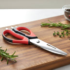 Kitchen scissors placed on kitchen countertop for food preparation