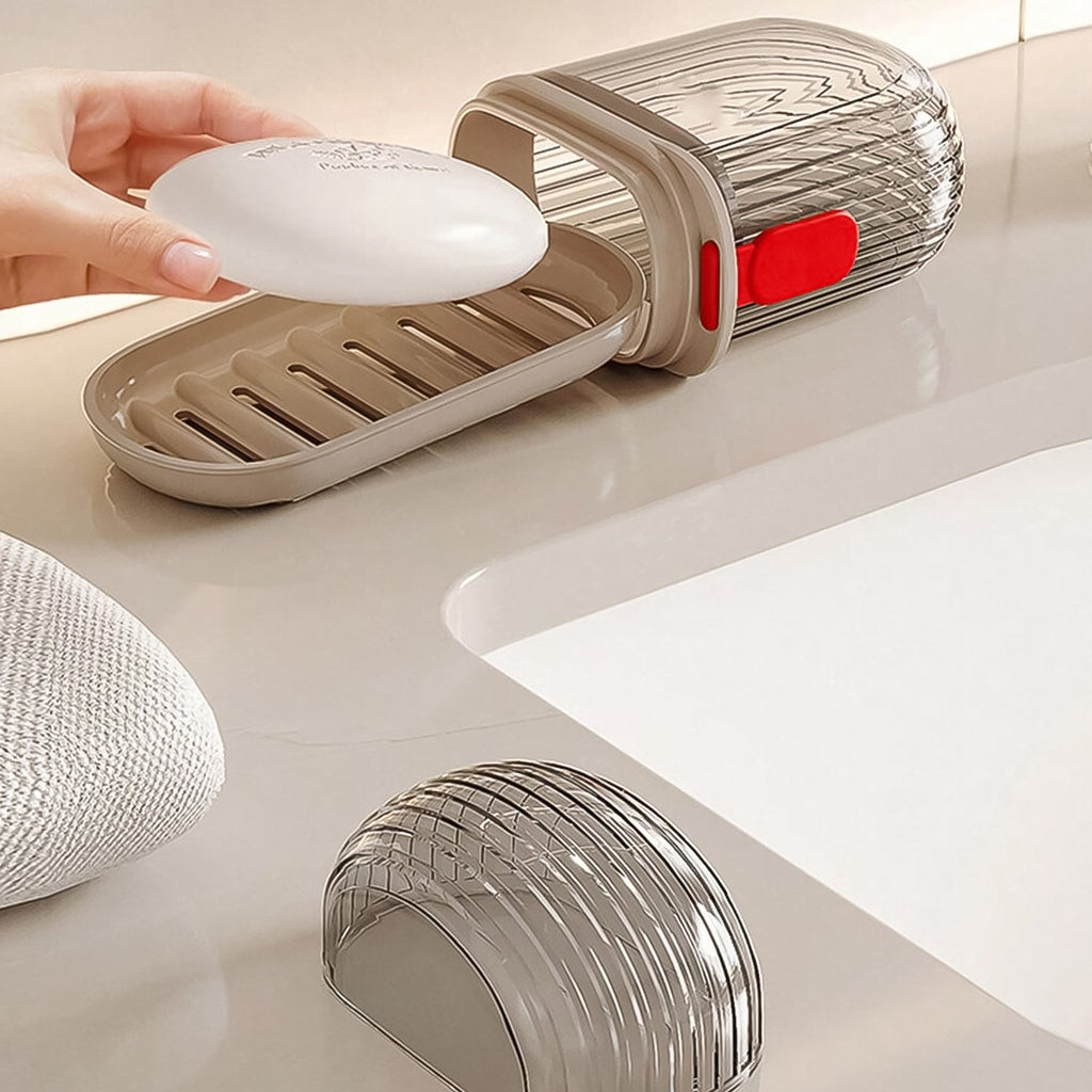 Compact travel soap dish in a transparent design, perfect for luggage and travel convenience.