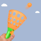 Brightly colored catapult ball toy set up for exciting outdoor play.