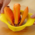 Close-up of the mango slicer's stainless steel blade for precision cutting.