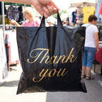 Foldable Thank You printed carry bag showing sturdy handle design