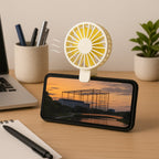 The portable mini fan demonstrating its versatile foldable handle for easy storage.
