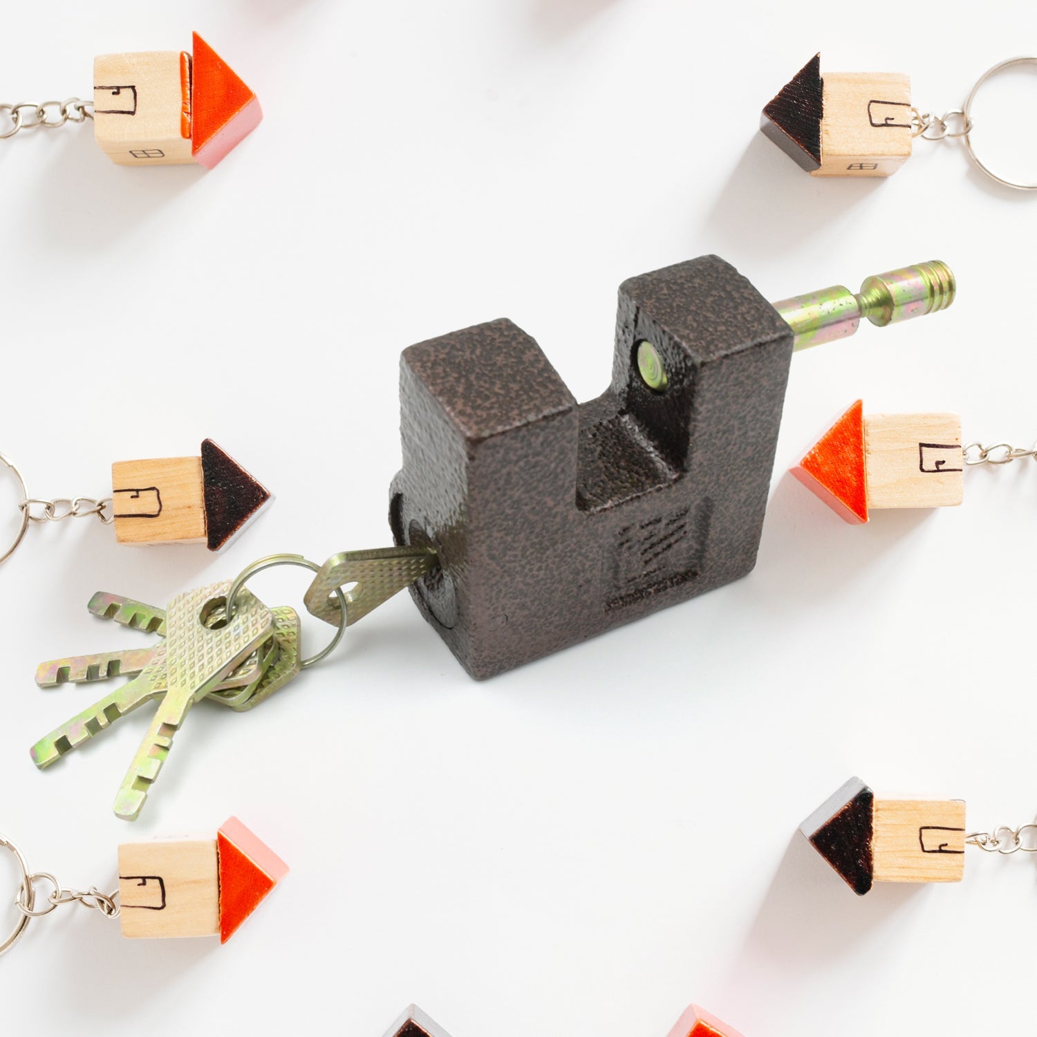 Heavy-duty black iron door lock installed on a warehouse gate for maximum security against intruders.