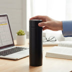 Lidded mug for hot beverages included in travel essentials combo set