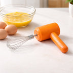 Electric handheld whisk mixer used for beating eggs and mixing batter