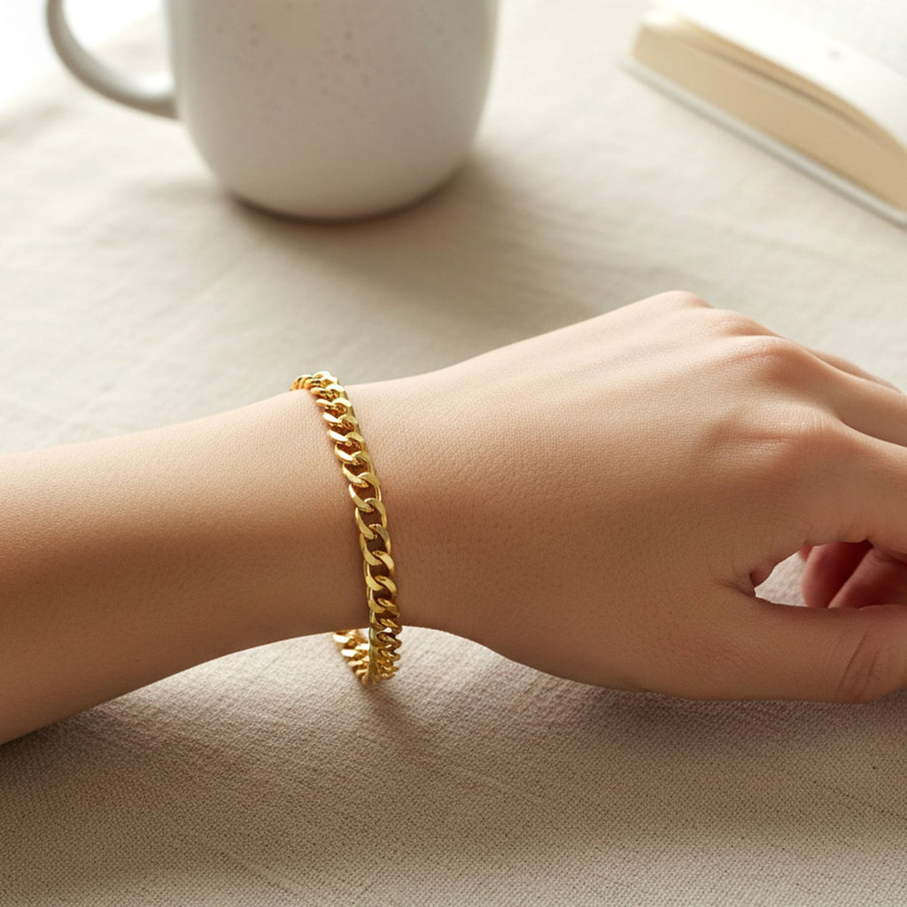 Gold finish metal chain bracelet showing interlocking links