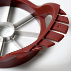 Perfectly sliced apple pieces arranged on a plate, with the core neatly removed by the apple slicer.