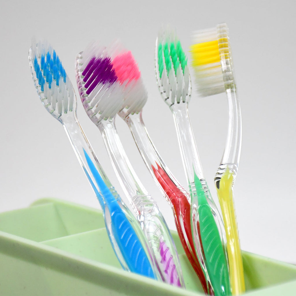 Side view of a MintGuard premium plastic toothbrush, showcasing its sleek design.