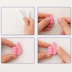 Flexible pink silicone hand-shaped clip holding a set of keys