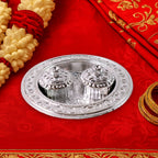 The small Kumkum Thali Holder filled with vibrant haldi and kumkum powder.