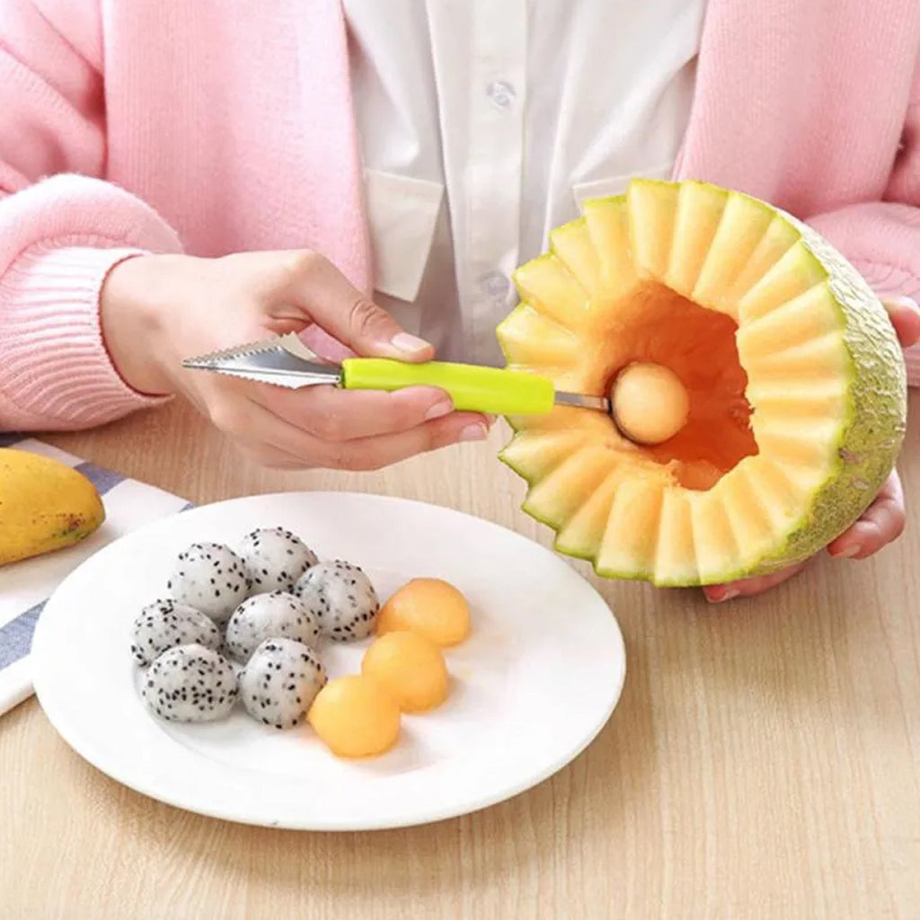 Stainless steel melon baller scooping perfect spheres from a cantaloupe.