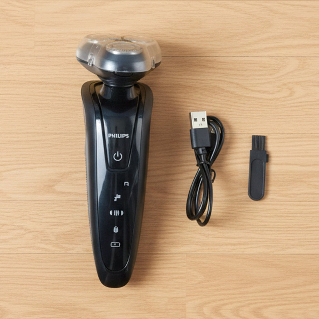 Close-up of rotary shaver trimming beard