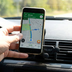 Side view showing installation of car air vent phone holder into vent blades