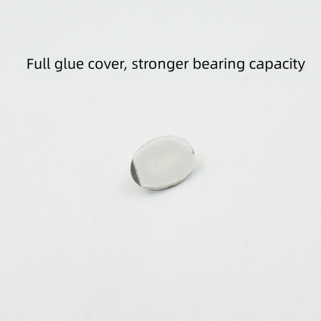 A single capsule-shaped stainless steel hook demonstrating its strong adhesive backing.