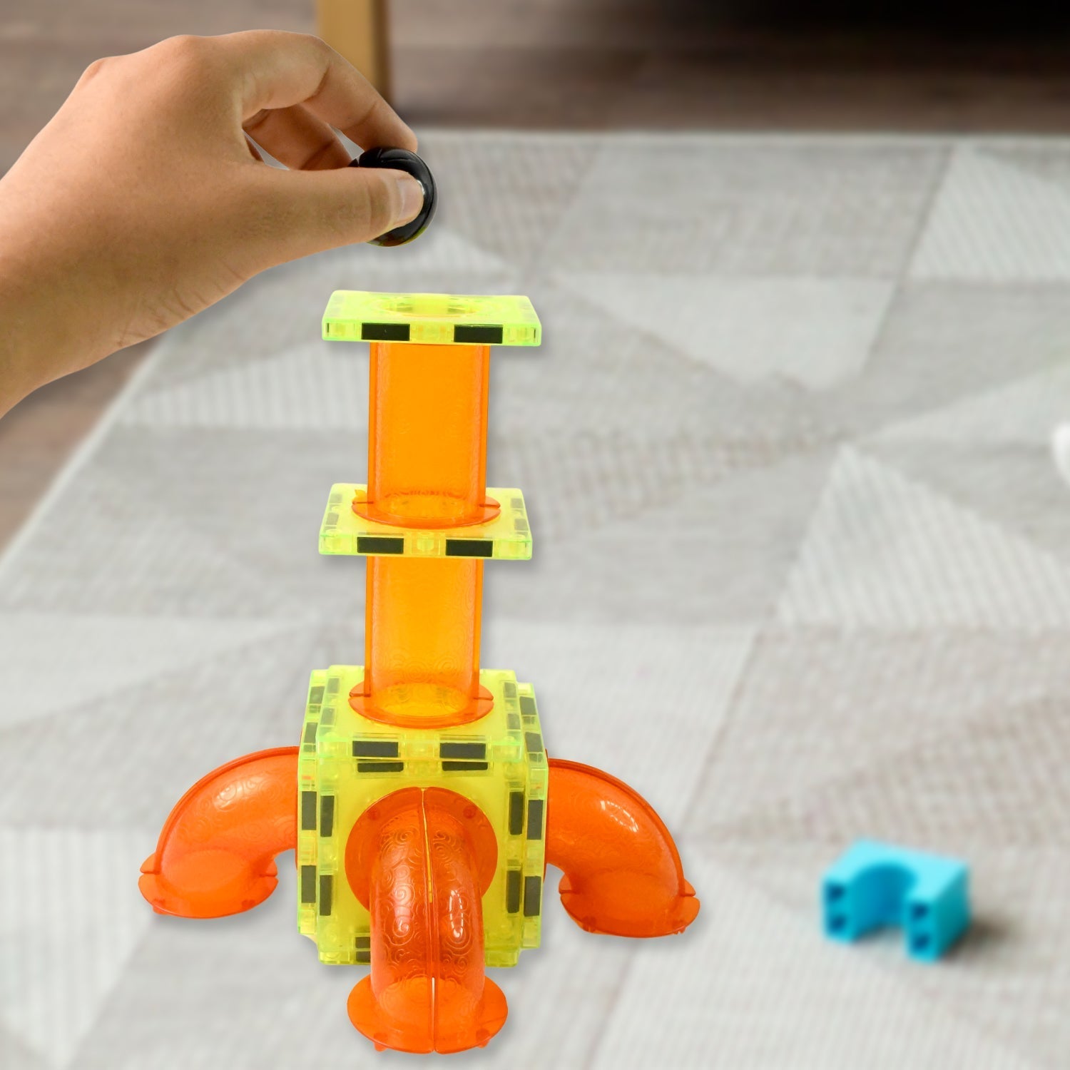 Colorful magnetic marble run construction pieces forming an elaborate track