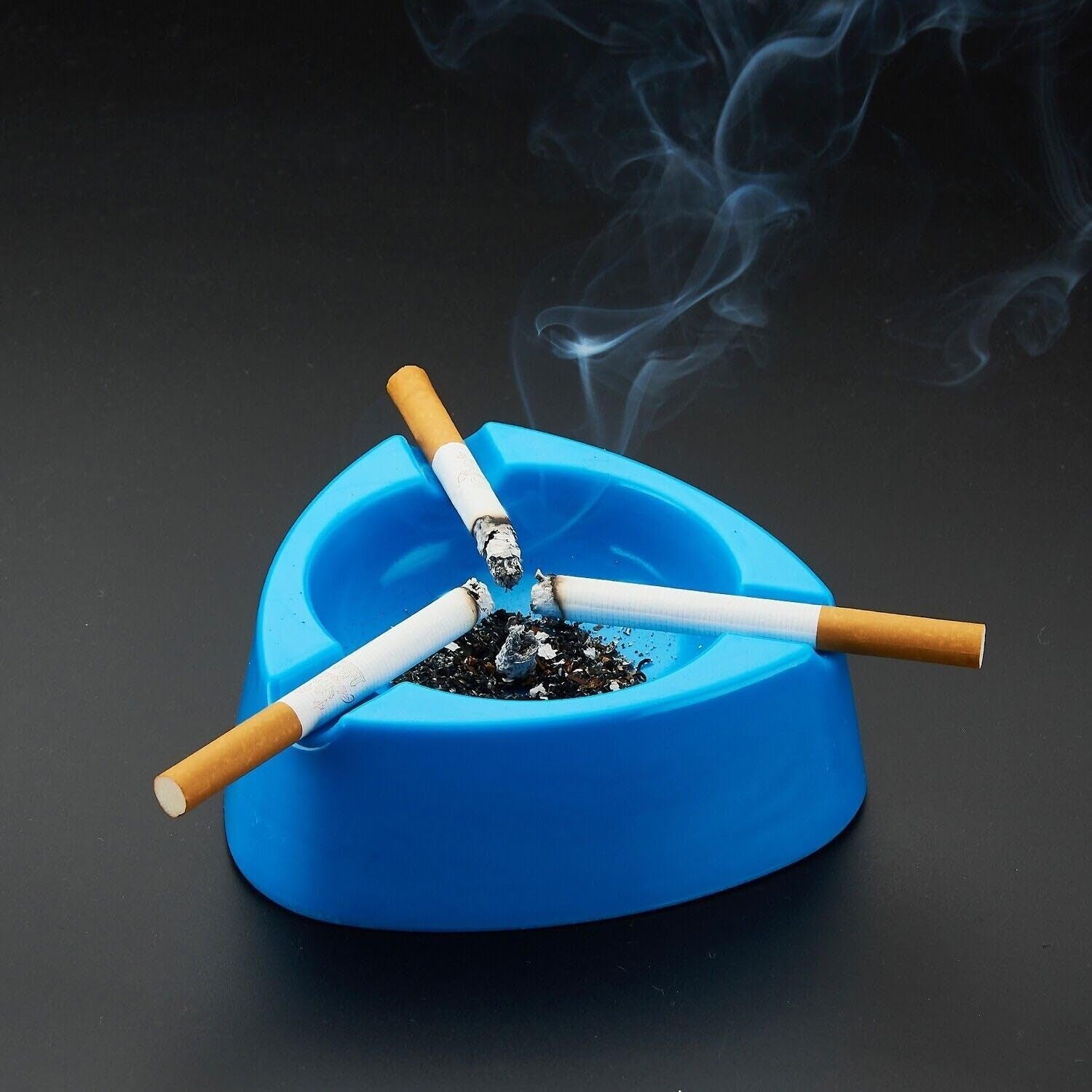 Sky blue plastic ashtray with wide bowl and triple cigarette holder slots