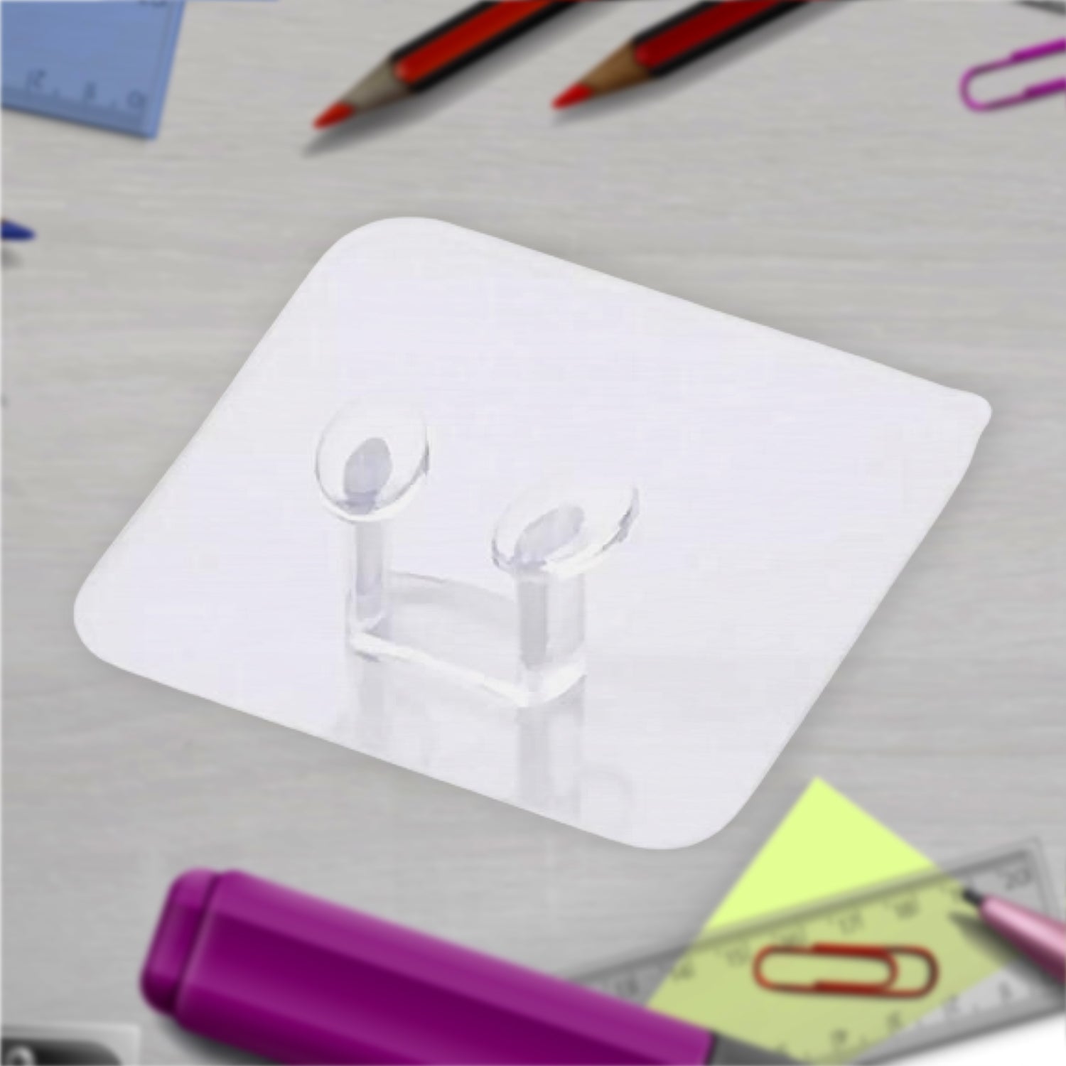 Transparent self-adhesive wall hook holding a set of keys by the entryway.