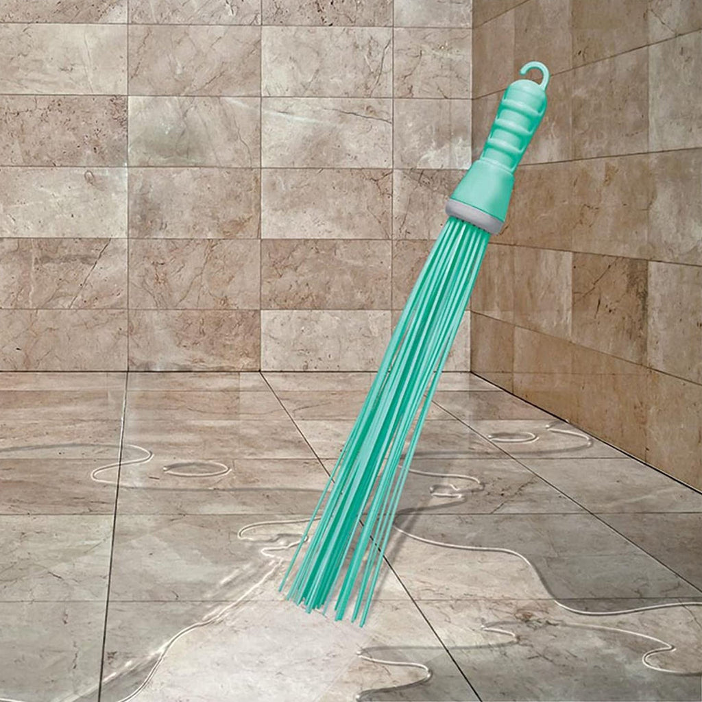 Ergonomic plastic handle of the hard bristle broom, designed for comfortable bathroom use.