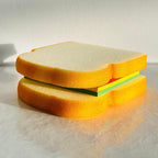 Stack of fun sandwich-themed sticky notes on a desk.
