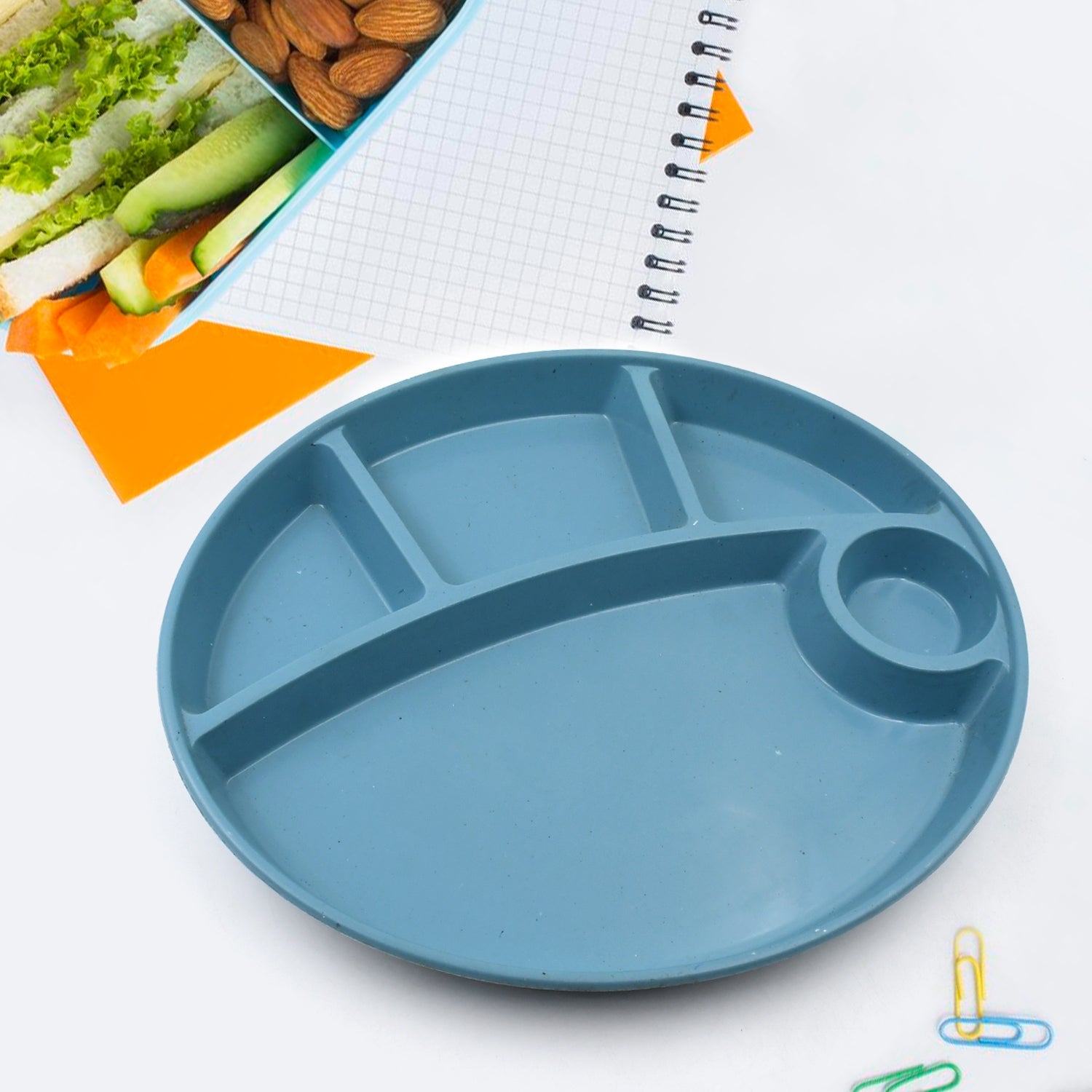 Stacked reusable kids plates showcasing their space-saving design.