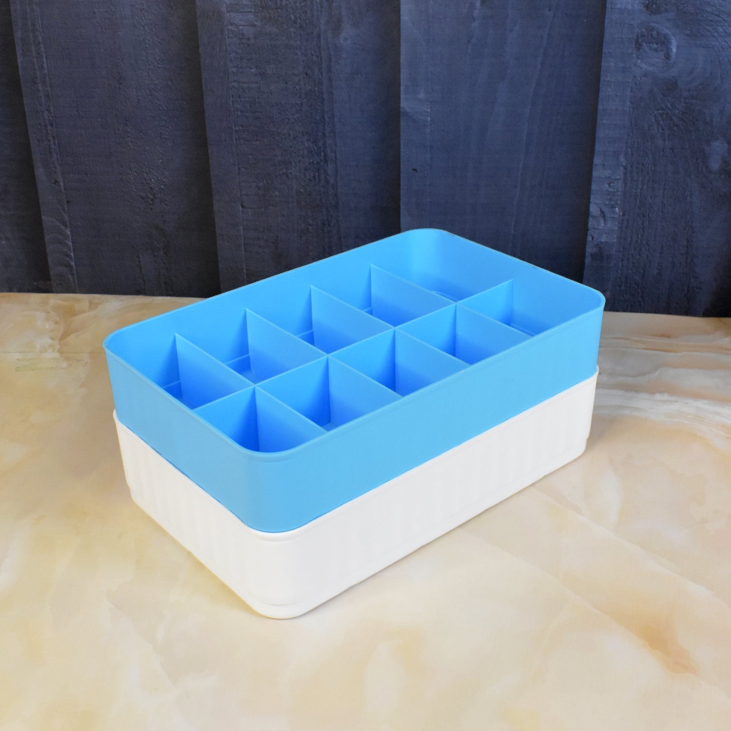 Detailed view of the multi-functional storage box compartments, highlighting their practical design.