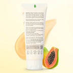 Fresh papaya slices alongside papaya face wash bottle