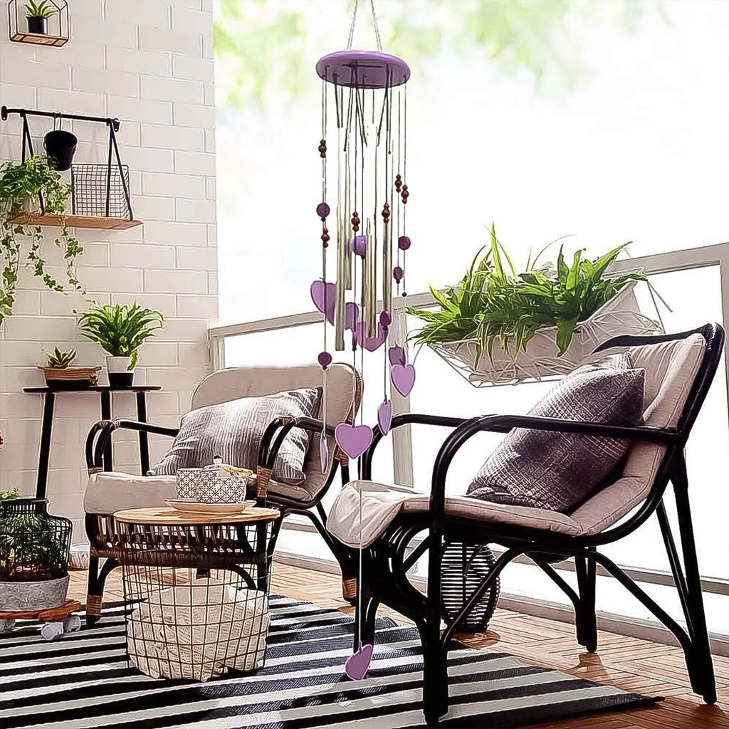 Side view of the handcrafted bamboo and aluminium wind chime with heart accents.