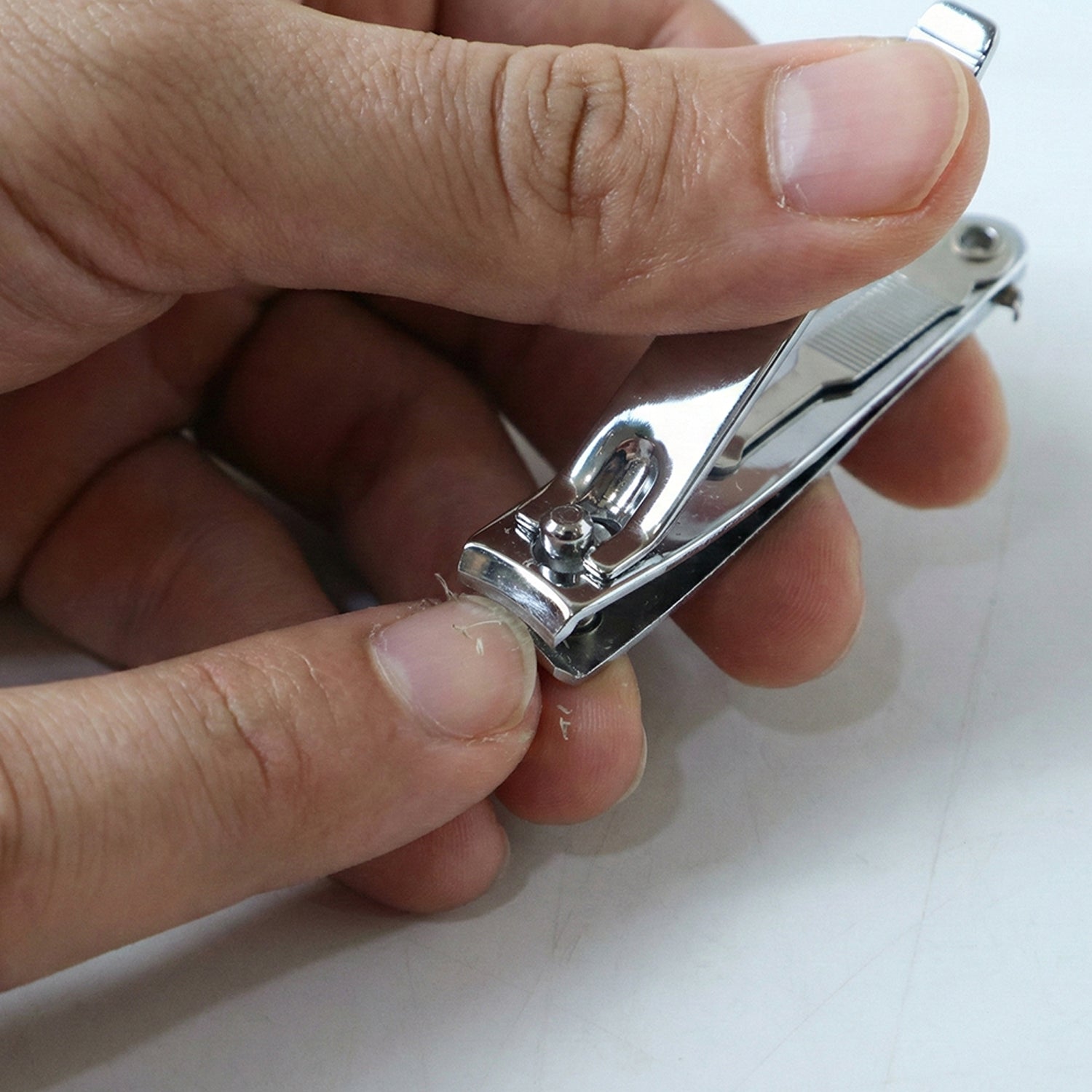 Nail trimmer showing precise stainless steel cutting edges for nails